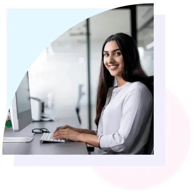 Woman typing at desk Woman typing at desk
