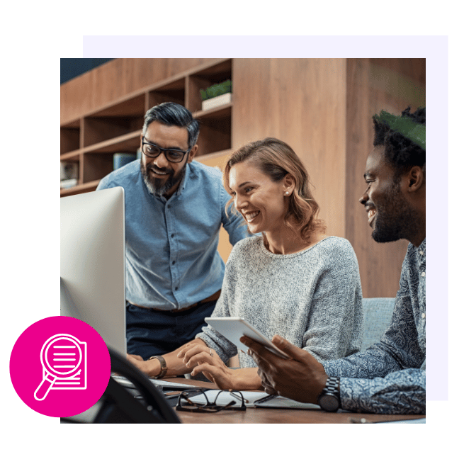 Employees viewing report on computer 