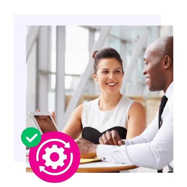 Two colleagues looking at laptop