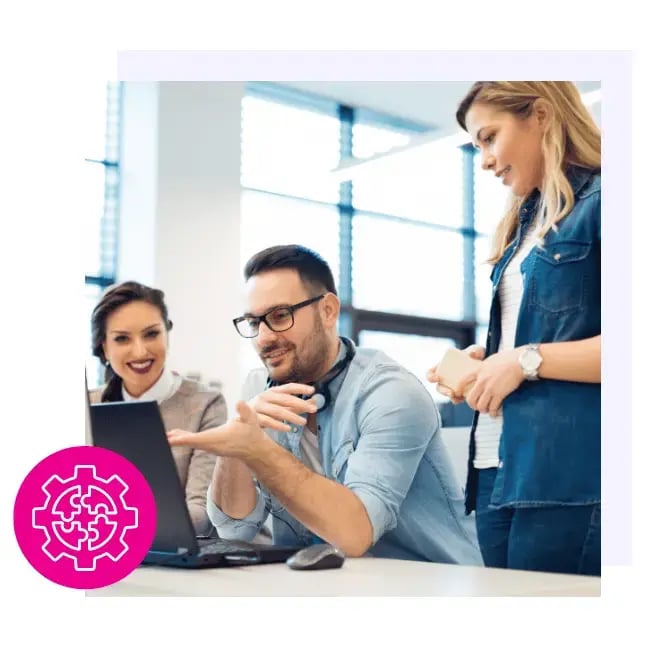 Team members looking at laptop